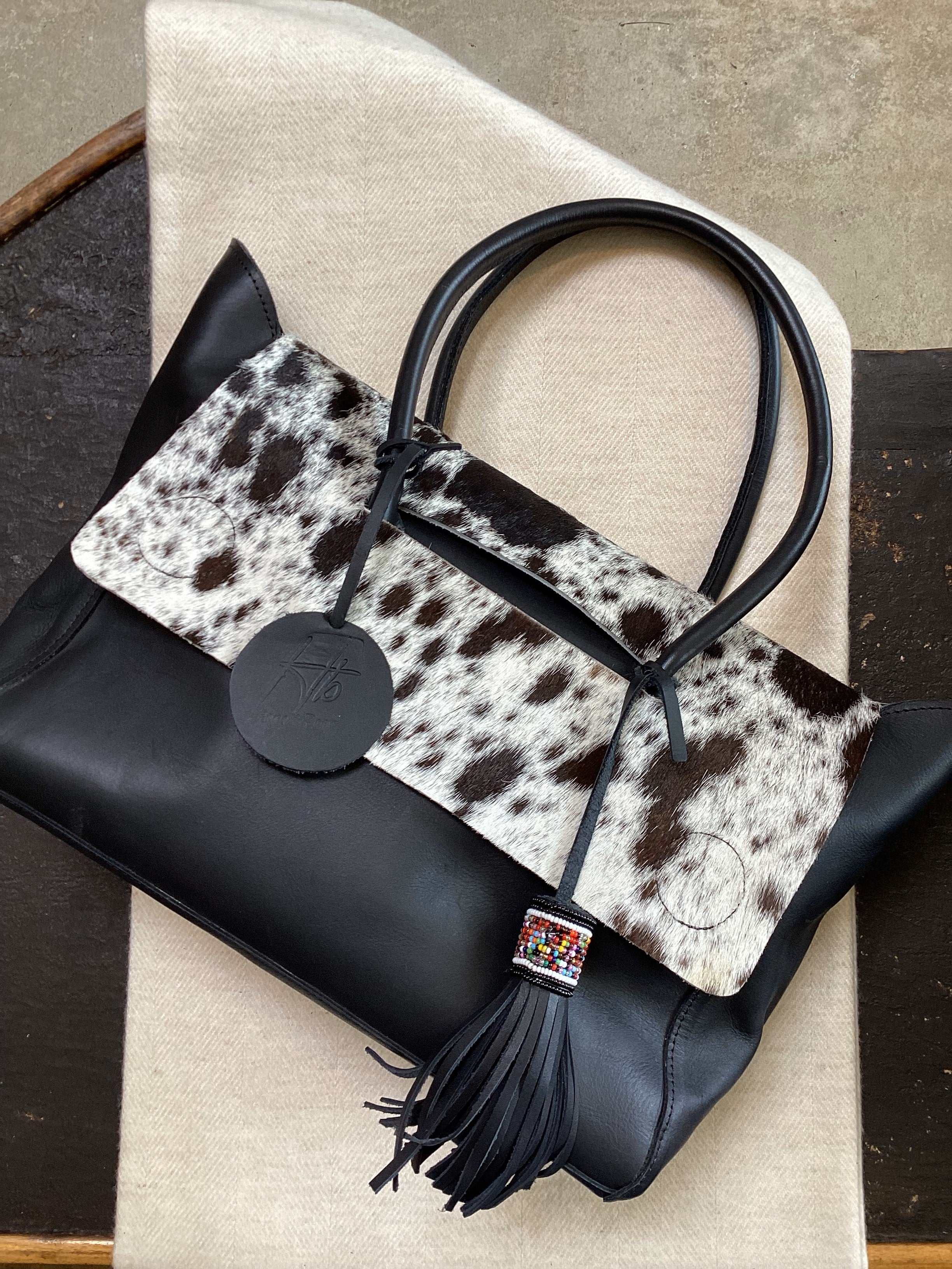 COWHIDE HANDBAG